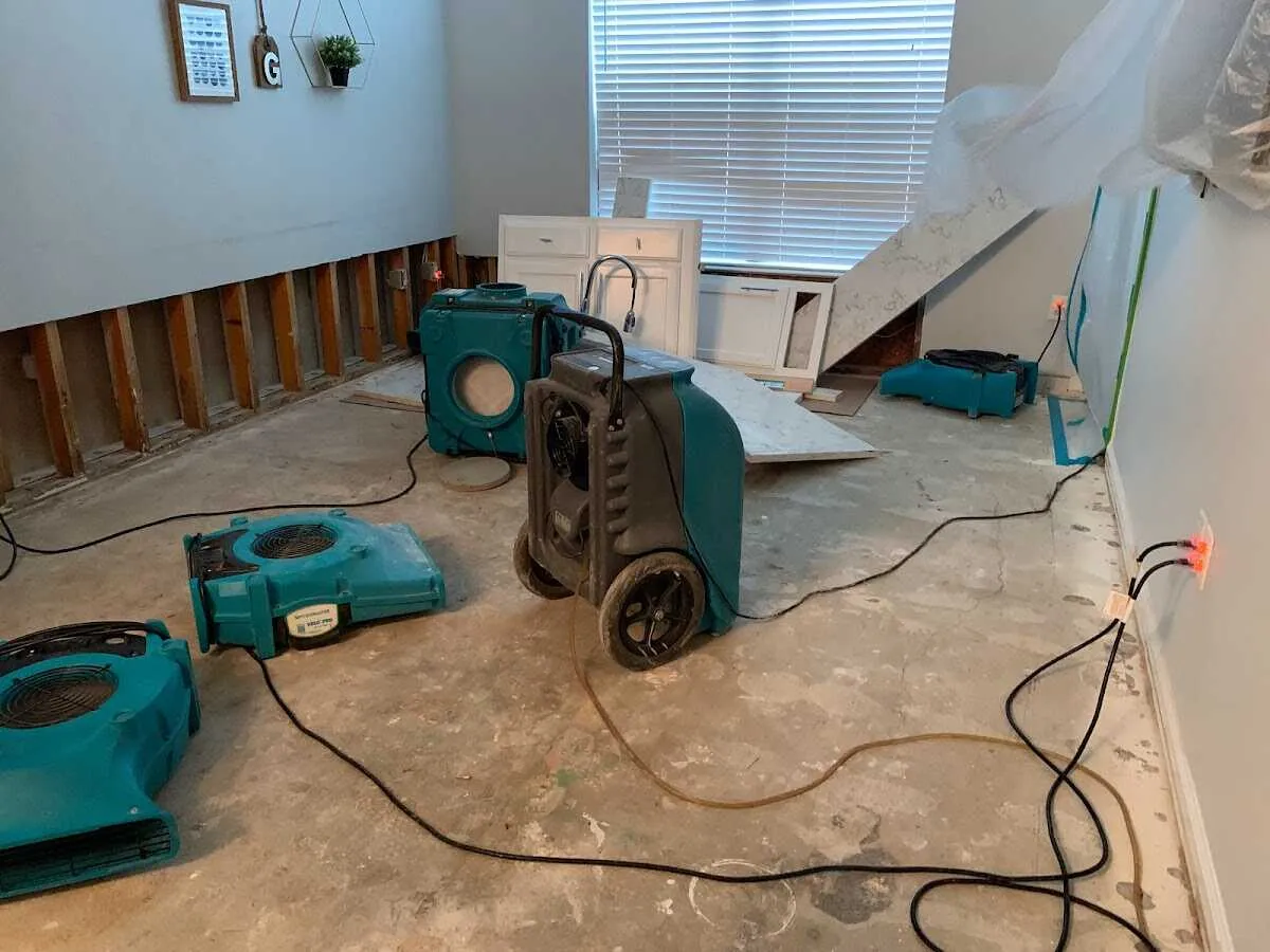 Dehumidifier in flood-cut room for Water Damage Restoration in Metropolis